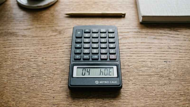 Close-up of a handheld digital calculator showing how numbers look like letters when inverted.